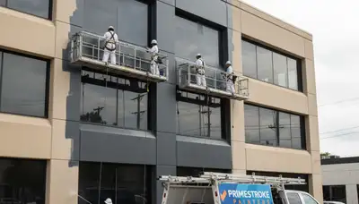 Professional commercial painters working on an office exterior in Los Angeles, CA