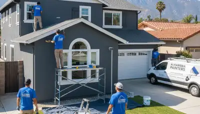 Professional house painters working on exterior home in Los Angeles, CA