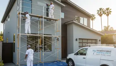 Professional house painters working on exterior home in Los Angeles, CA